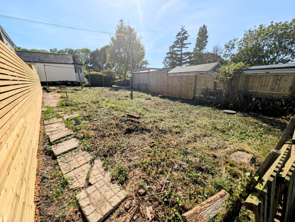 Lot: 92 - LAND WITH PLANNING FOR A DETACHED CHALET STYLE HOME - A Picture from the Rear of the Site